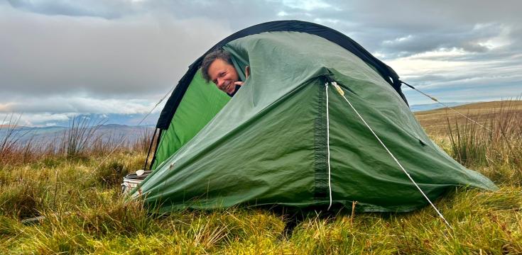 Man in a tent wild camping