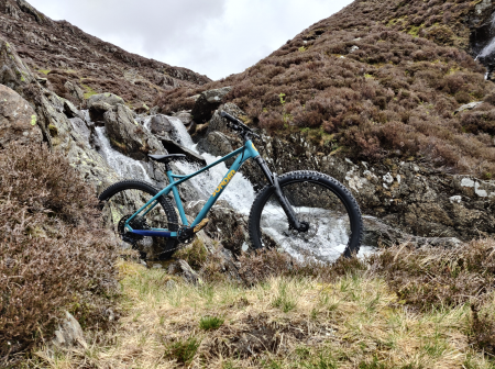 Mountain Bike in front of waterfall