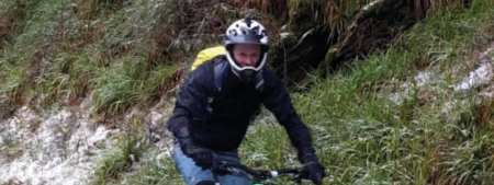 Mark riding a mountain bike in fun face helmet