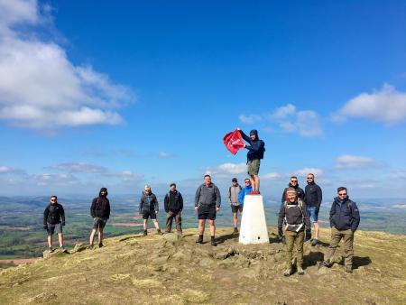 Socially distanced group at a trig point