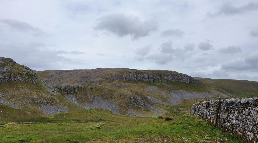 Drystone wall and view of hill