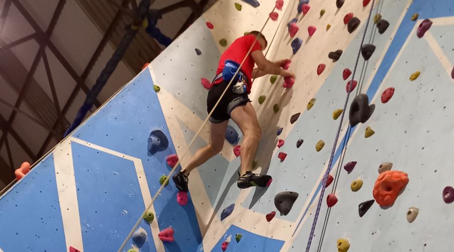 Wide shot of climber on wall