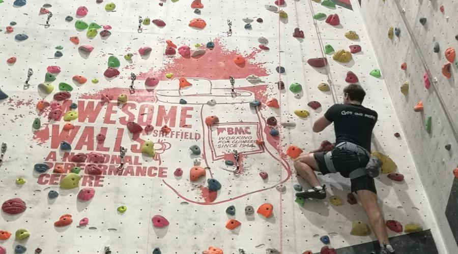 Indoor climbing wall with climber 