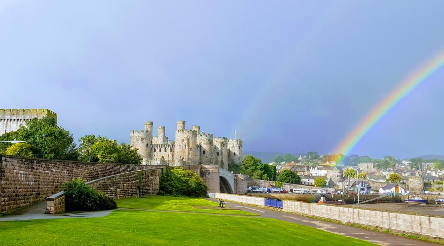 Conwy castle with the rainbow behind