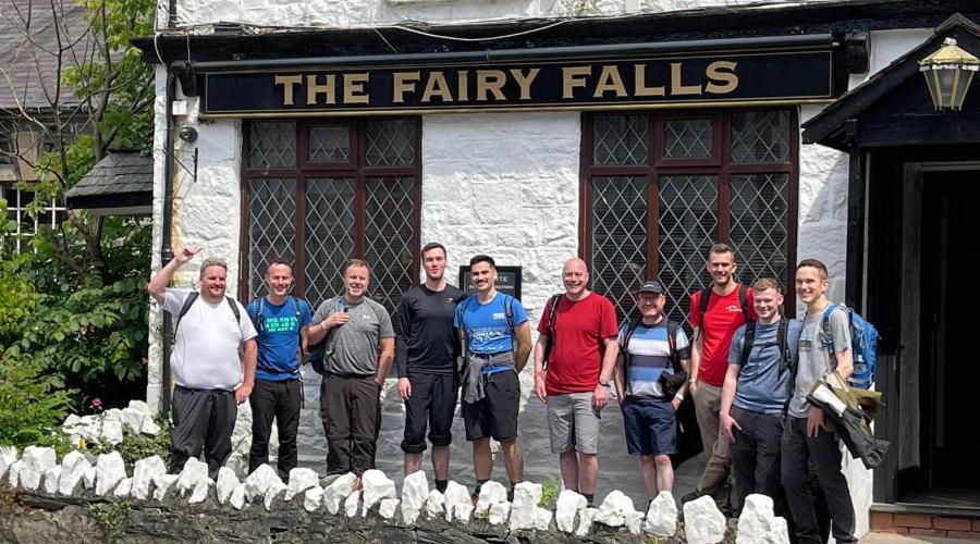 hikers in front of pub