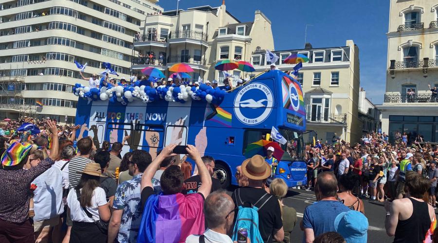 Brighton and hove Albion football team bus at pride