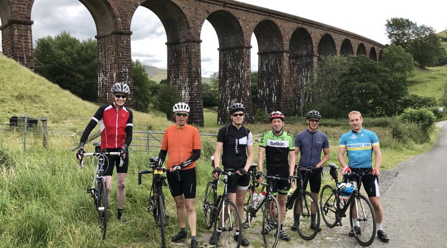 Group shot in front of viaduct