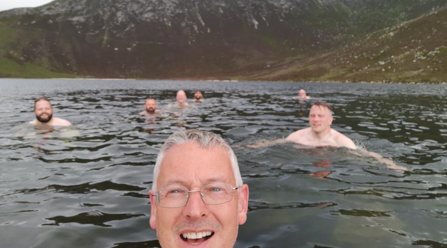 Wild swimming in a mountain lochan