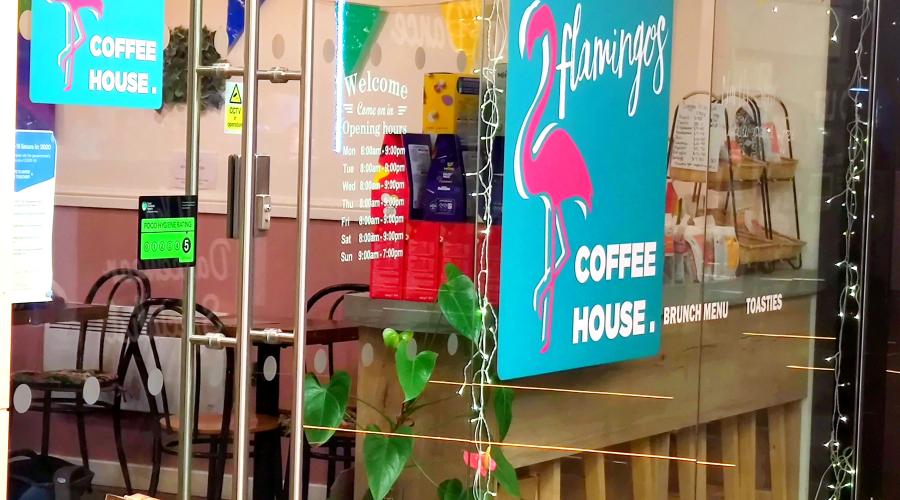Photo of LGBT coffee house window with bunting