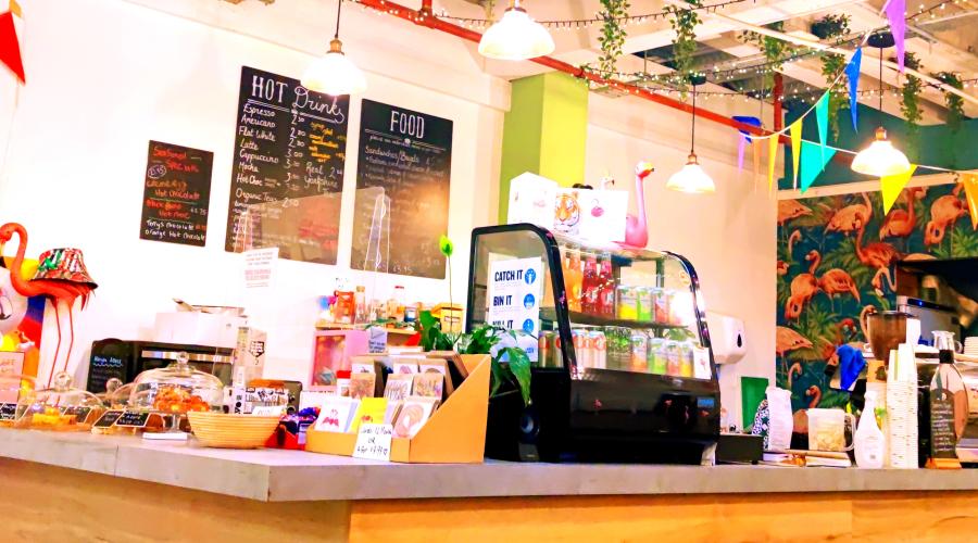LGBT Coffee House Counter with Cake on and bunting