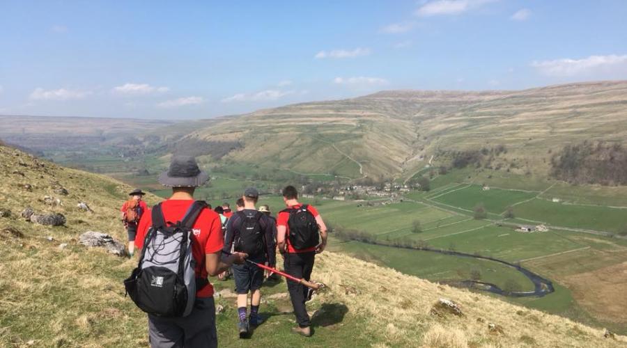 Great Whernside, walkers with backpacks.