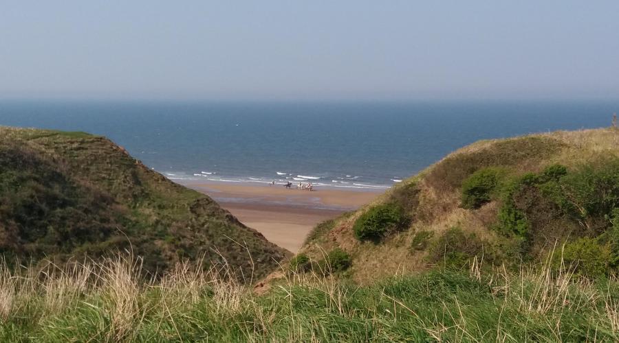 Looking down to horse riders near Marske Beach