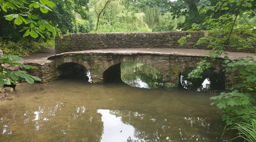 The Roman (or Smart's) bridge at far end of Castle Combe