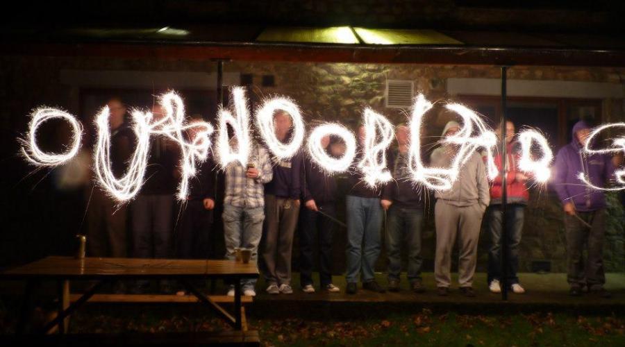 Sparklers spelling out the word "Outdoorlads"