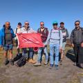 Guys on a moor holding a red outdoorlads flag