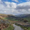 Track on the Pennine Way with view down valley 