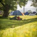 Camper at his tent