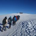 Walking towards the summit in snow