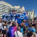 Brighton and hove Albion football team bus at pride