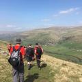 Great Whernside, walkers with backpacks.