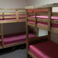 A bedroom with two bunkbeds