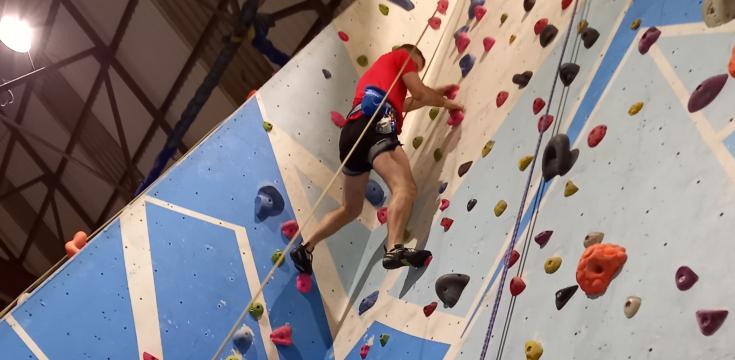 Wide shot of climber on wall