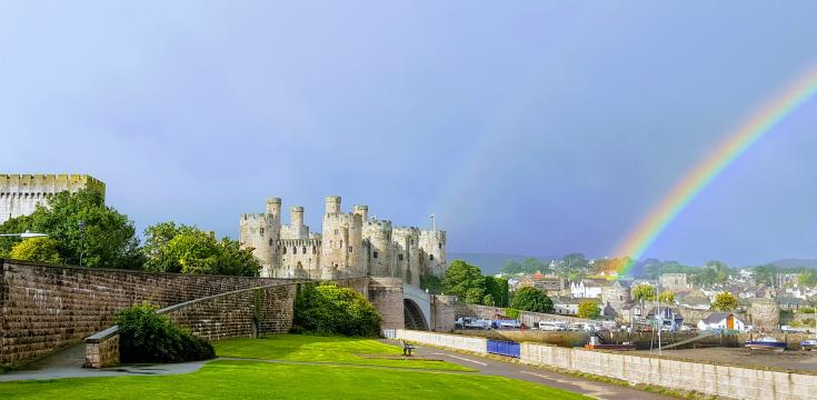 Conwy castle with the rainbow behind