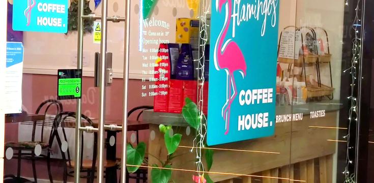 Photo of LGBT coffee house window with bunting