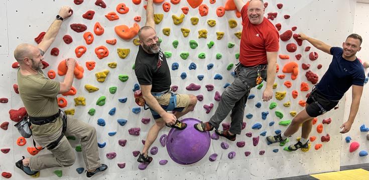 Outdoorlads climbers on the rainbow feature wall
