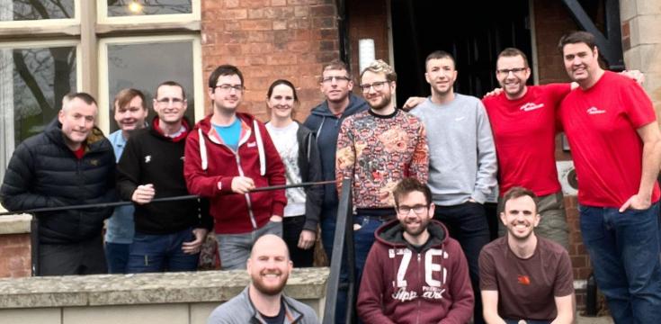 Group picture of trustees outside a YHA building