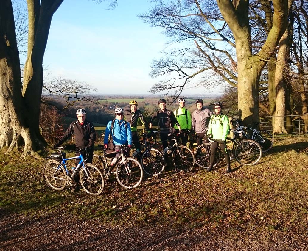 A group cycling in a forested area