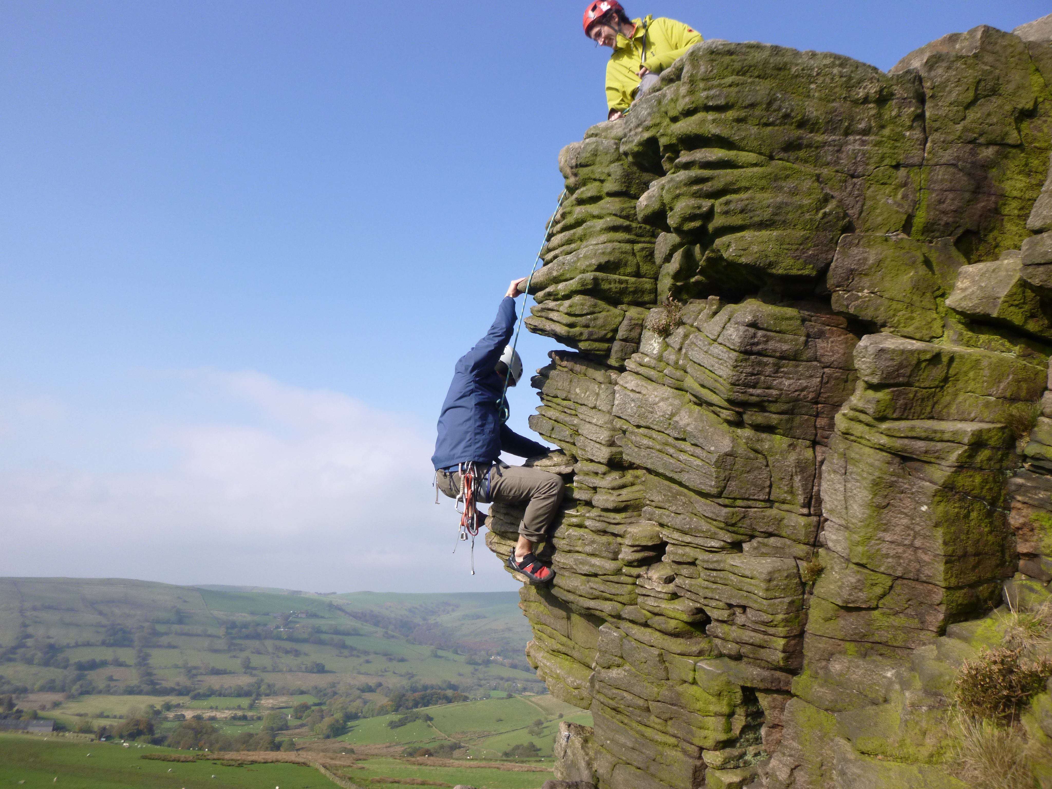 two guys climbing an arete